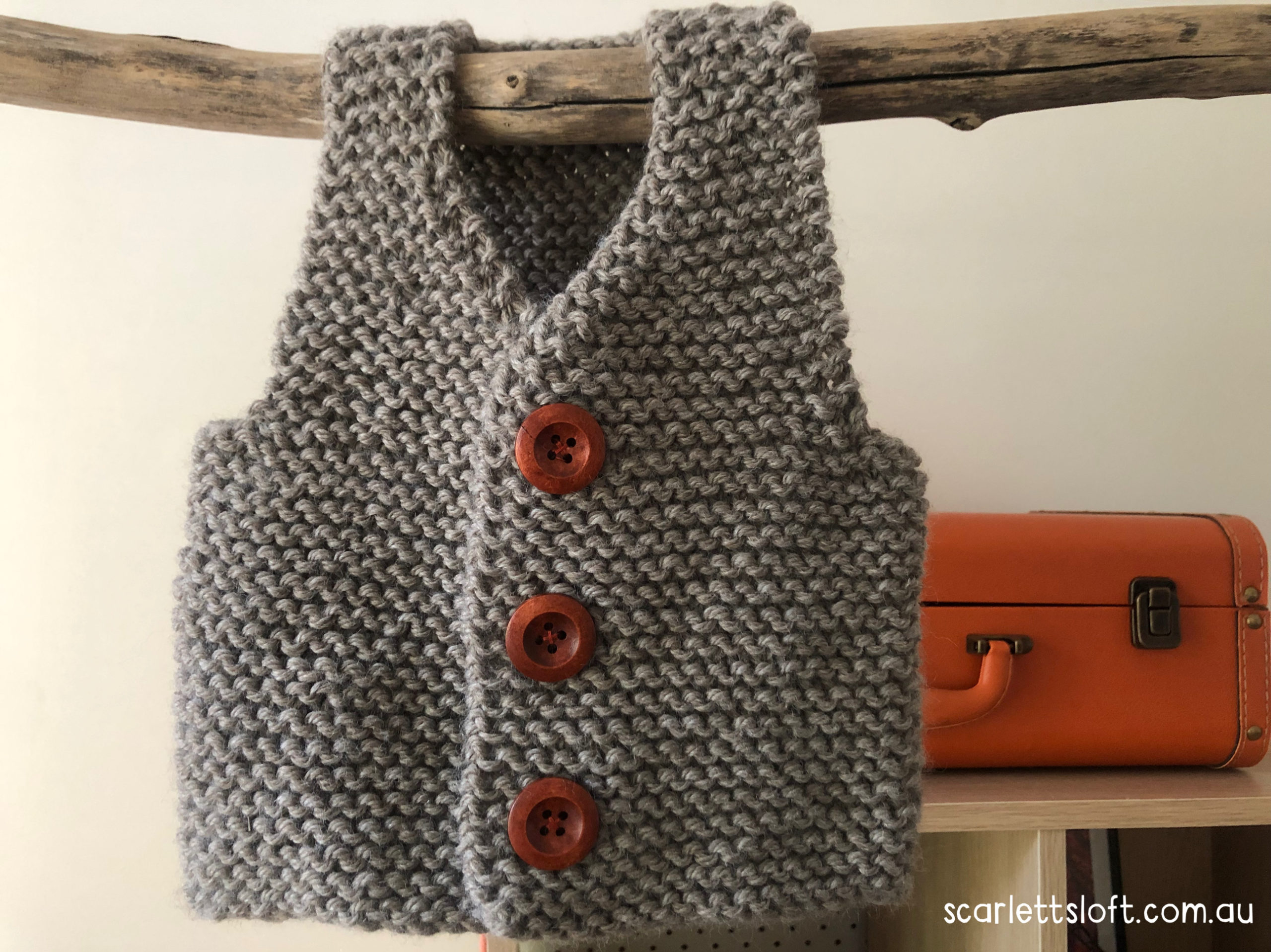 Hand knitted baby vest. Made in Australia.
